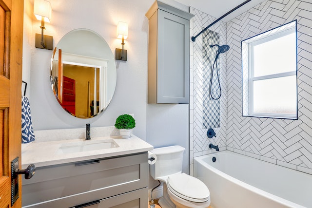 Photo of A Bathroom With Oval Mirror Near Toilet Bowl
